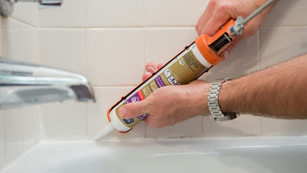 Gold Coast Caulking Services, Man caulking a bathroom